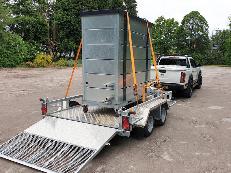The 90kW unit strapped to its trailer with the loading ramp down