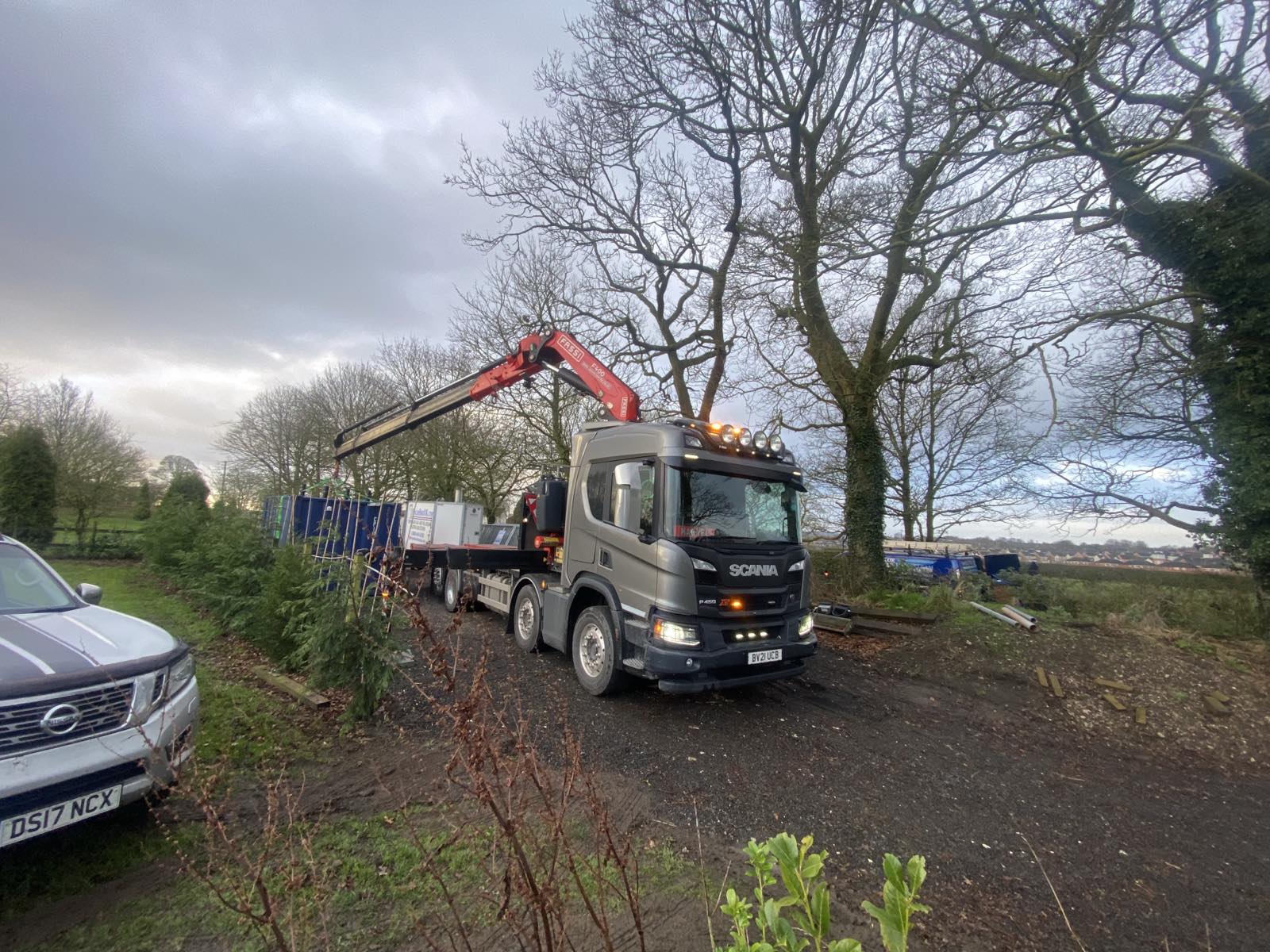 A crane lorry loaded with a temporary boiler, ready to leave for site